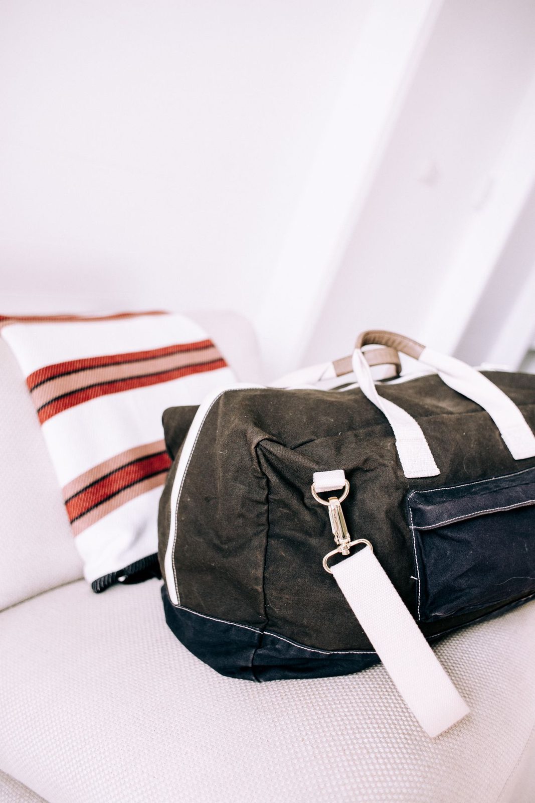 The Ashcroft waxed weekender, packed and waiting by a sofa